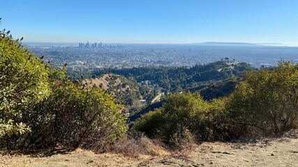 Wide view of Los Angeles county, with Downtown city skyline and Griffith Park observatory seen from...