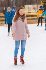 young beautiful woman ice skating in winter healthy lifestyle concept