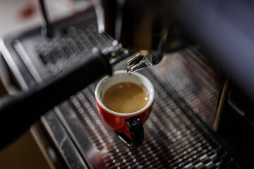 Close-up of old coffee machine with scratches in a bar