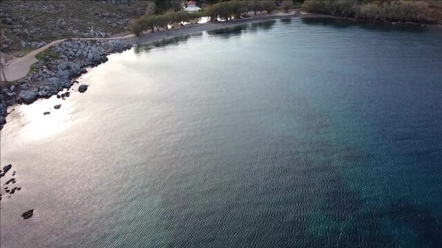 Aerial view of Agios Isidoros chapel, a church on an imaginary islet at Chios Island, Greece