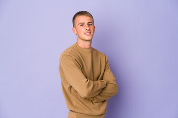 Obraz premium Young caucasian handsome man who feels confident, crossing arms with determination.