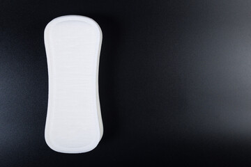 White daily panty liner. Daily female gasket on black with copy space.