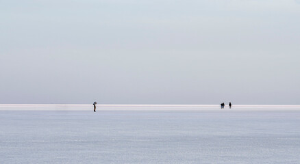 salt lake with figures of people with a good view of minimalism good background there is a place for text