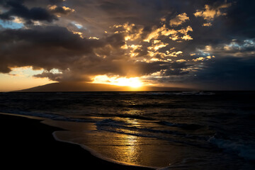 Sunset Glowing over Ocean with Island on Horizon