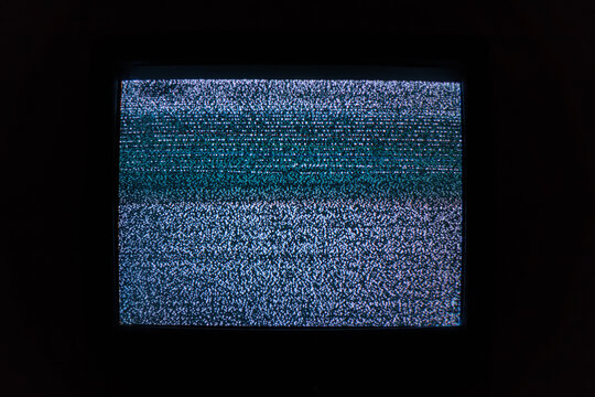 Old TV screen with noisy image due to lack of TV signal