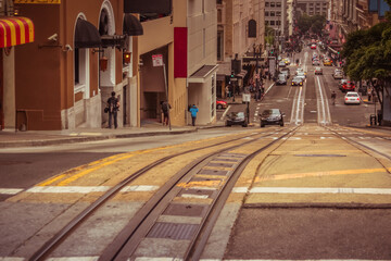 A vertical shot of a road sloping downhills in the busy city of San Francisco, California, United...