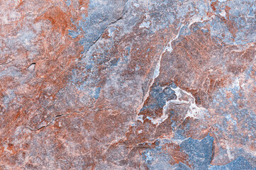 Textured granite stone surface close up. Natural granite stone for laying on the floor..Stone background for high resolution wallpaper.