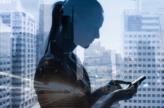 Young woman using her smart phone tablet in a modern city setting. Technology and communication concept.  