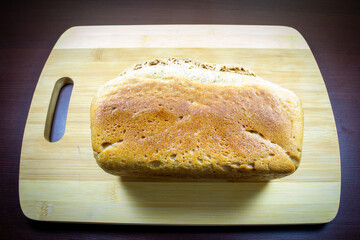 Freshly baked bread on a wooden board.