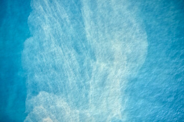 Clear blue sea texture. Blue sea water surface. Abstract background.