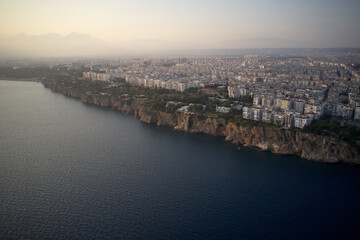 Panorama of resort town on Mediterranean coast. Panoramic aerial view of seaside resort. Antalya, Turkey.