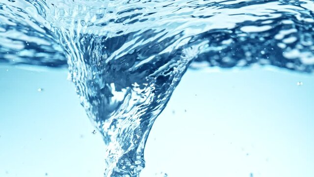 Super Slow Motion Shot of Water Whirl on Light Blue Gradient Background at 1000fps.