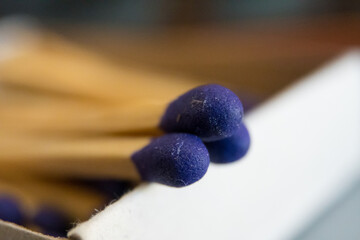 Macro closeup photo of match heads with bokeh background.