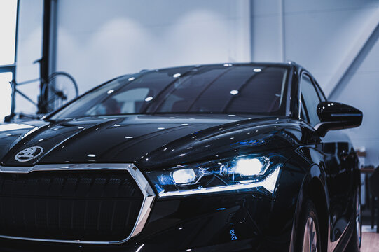 T&oslash;nsberg, Norway - February 11, 2021: black Skoda enyaq IV is a suv electric car. New car in car dealership show room.