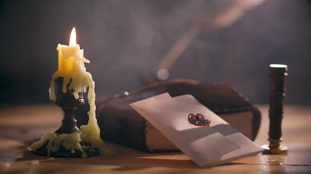 Scene from the 18th century of a hazy candlelit room where a letter sealed with paraffin and a wax stamp to secure the letter is only opened by the intended is displayed.