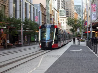 Fototapeten Tram moving through George St in Sydney NSW Australia © Elias Bitar