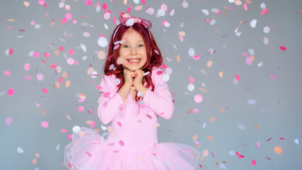 Fototapeta na wymiar happy birthday girl with confetti on gray background