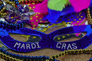 Mardi Gras Face Masks With Jewelry And Feathers On Gold
