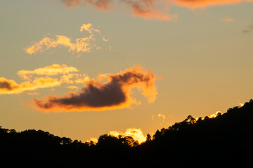 Silhouette of trees and clouds at sunset outdoors in rural Guatemala, inspiration reflection of heavenly creation.
