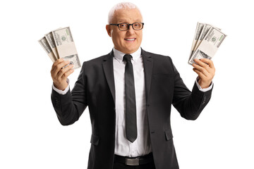 Mature businessman holding stacks of us dollar banknotes