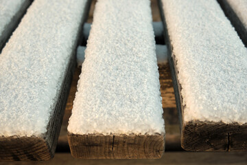 closeup of wooden planks covered with ice crystals during the winter