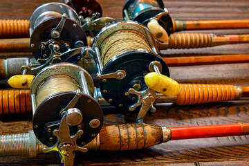 Vintage bamboo fishing rods and conventional reels - 414257433
