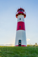 Fototapeta na wymiar Lighthouse List East on a dune of the island Sylt, North Sea, Germany, HDR, Panorama vertical.