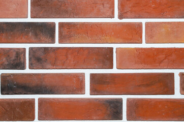 Obraz premium Texture of red brick wall for design of the basement of the house.