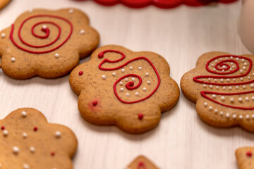 Handmade gingerbread cookies with a pattern on a wooden surface. Photo series