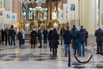 LVIV, UKRAINE - FEBRUARY 10, 2021: Interior of the Greek Catholic Church of Sts. Olha and Elizabeth. People listen to the service.