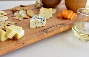 Gourmet wine and cheese charcuterie platter ordering out from restaurant for romantic date night at home on special occasion holiday or birthday. Photo concept, food lifestyle, background, close-up