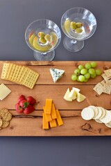 Gourmet wine and cheese charcuterie platter ordering out from restaurant for romantic date night at home on special occasion holiday or birthday. Photo concept, food lifestyle, background, close-up