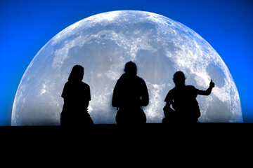 Family at Night Together with Thumbs Up Full Moon