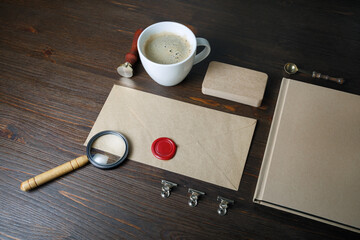 Photo of blank vintage stationery elements on wood table background. Responsive design mockup. ID...