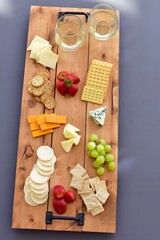 Gourmet wine and cheese charcuterie platter ordering out from restaurant for romantic date night at...