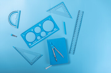 Items of the same color. Items for sketching. Notepad and rulers.