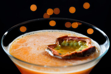 Pornstar martini cocktail with passionfruit garnish