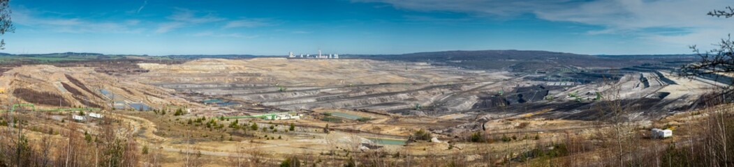 Fototapeta na wymiar Panorama of lignite opencast mine and Turow power plant in the city Bogatynia, PolandPanorama kopalni odkrywkowej węgla brunatnego i elektrowni Turów w Bogatyni