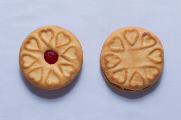 Red centered jam biscuits with a strawberry flavor and on a plain white background
