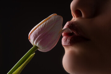 Female lips and spring flower. Sexy woman mouth and flowers. Oral sex, orgasm, blowjob, licking...