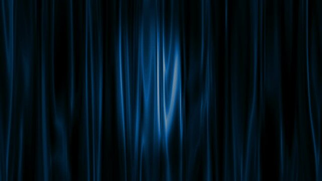  Spotlight moves diagonally across blue satin theater curtains