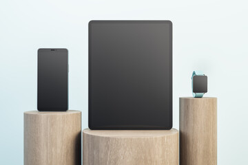 Blank black screen of modern gadget set on wooden stands at abstract background. Mockup