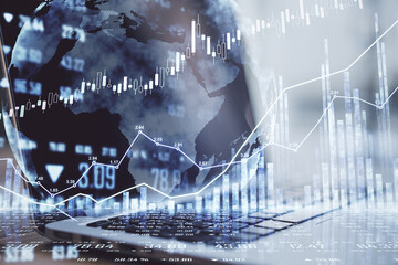 World stock market concept with world map, laptop and forex chart diagram. Double exposure