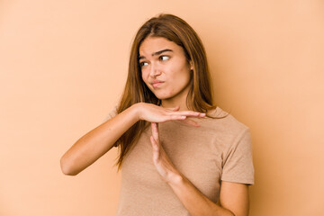 Young skinny caucasian teenager girl showing a timeout gesture.