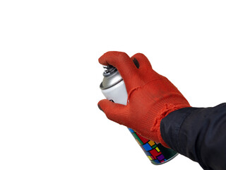 A man holds an aluminum spray can with graffiti or airbrushing paint in his hand with a red glove in the workshop. Mockup, a place to insert the background.