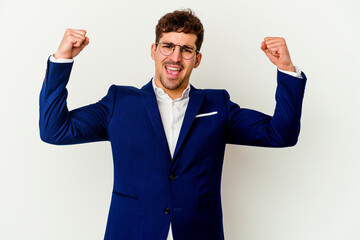 Young business caucasian man isolated on white background cheering carefree and excited. Victory concept.