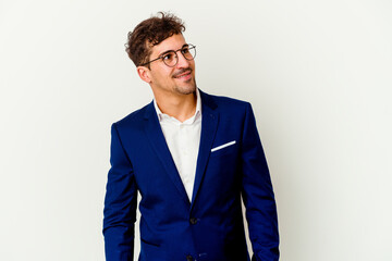Young business caucasian man isolated on white background relaxed and happy laughing, neck stretched showing teeth.