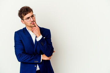 Young business caucasian man isolated on white background looking sideways with doubtful and skeptical expression.