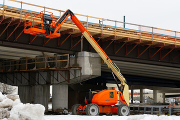 telescopic elevator in the construction works of an overpass © Victor