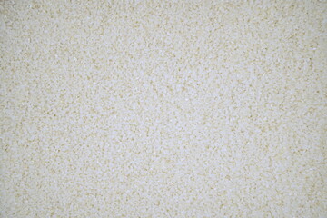 Uncooked rice texture background, peeled grains and agricultural planting